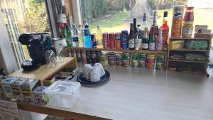 a counter with a bunch of different types of drinks at Camping - Bring your tent or van and experience our club! in Feldkirchen bei Graz