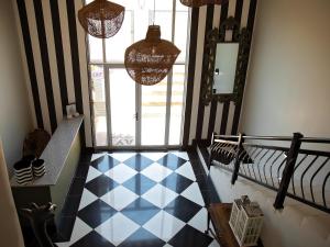 a room with a blue and white checkered floor at Stay in Postmasburg