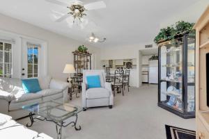 a living room with a couch and a table at 4111 Gunnison Ct #1214 in Estero