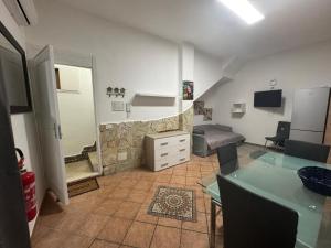 a large living room with a couch and a bed at Fabian Appartament in Bagheria +4 photos