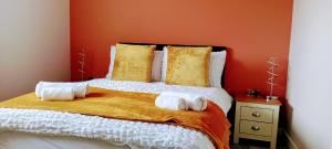 a bedroom with a bed with towels on it at Martindale Close - 3 Bedrooms - Sleeps 5 in Whitehaven