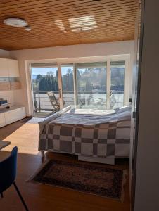 a bedroom with a bed and a large window at Helles, sonniges, ruhiges Apartment in Wuppertal