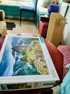 a pizza box sitting on top of a table at le Cabanon Beldi in Rabat