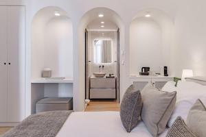 a bedroom with a bed and a bathroom with a sink at Promenade Chios Port Residences in Chios +111 photos