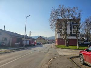 a street with a fire truck parked on the side of the road at Apartman IVA in Modriča