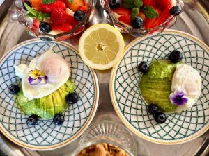 three plates with fruit on them on a table at Manoir du Val Riant in Saint Malo +45 photos