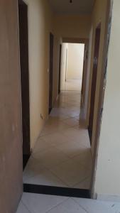 an empty hallway of a house with ailed floor and walls at Casa de Trindade-Go in Trindade