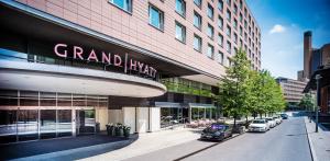 a grand hyatt building with cars parked outside of it at Grand Hyatt Berlin in Berlin +158 photos