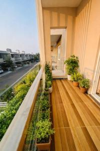 a balcony with potted plants on a building at Premium Villa Stay Near the Airport Perfect for Families & Business Travelers in Hyderabad