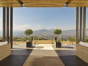 a room with a view of the mountains at Semeli Estate Suites in Koútsion