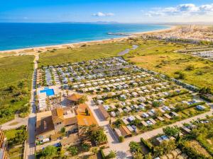 an aerial view of a parking lot next to the beach at Camping Castelló Mar in Empuriabrava +43 photos