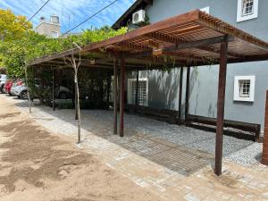 a pavilion in front of a house at VALERIA 4 Ambientes in Valeria del Mar