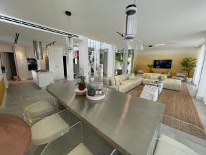 a large living room with a table and a couch at Seashell 2nd row sea Villa in El Alamein