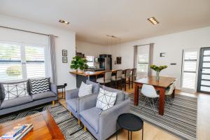 a living room with a couch and a table at Lorelei Guest House in George
