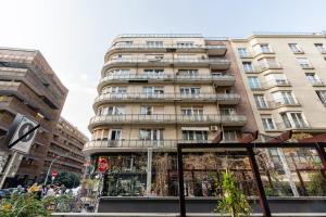 a tall building in the middle of a city at Madach City Studio in Budapest