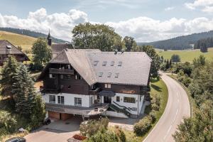 an aerial view of a large house with a road at stuub jostal in Titisee-Neustadt