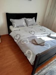 a bedroom with a bed with hearts on it at Apartman Centar 1 in Banja Luka