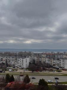 a view of a city with buildings and a parking lot at Apartment Rozen in Varna City