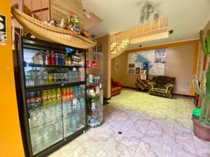 a room with a soda machine in a store at Nayras Puno Hotel in Puno