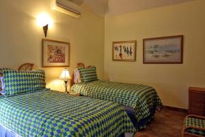 a hotel room with two beds in a room at Spicy Hill Villa in Port Antonio +38 photos