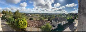 an aerial view of a house in a village at AMORE suite de luxe & spa in Laplume