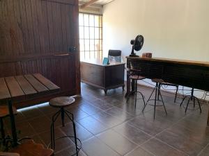 an empty room with a piano and stools in it at Hotel economic in Sorocaba +23 photos