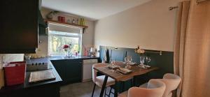 a kitchen with a table and chairs in a kitchen at Downings View in Ballynaworthra