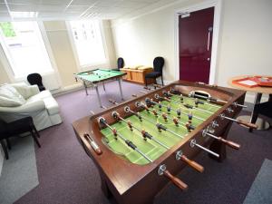 a room with a foosball table in the middle at YHA Alnwick - Partner in Alnwick