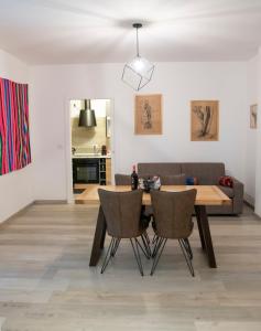 a dining room with a table and two chairs at Borgo Dei Cedri in Bari