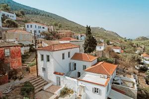 an aerial view of a village with white houses at Earino apartments in Hydra
