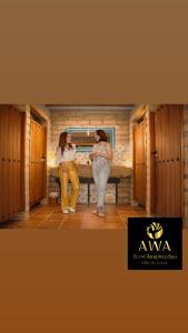two women are standing in a locker room at AWA ECO GlAMPING SPA in Villa de Leyva