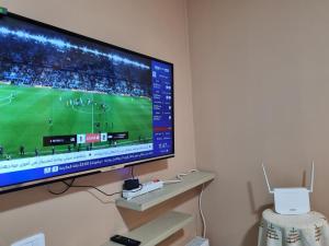 a flat screen tv hanging on a wall at Perle studio lac 2 tunisia mall in Tunis +1 photo