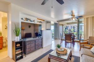 a living room with a kitchen and a dining room at Hale Ono Loa 204 in Lahaina