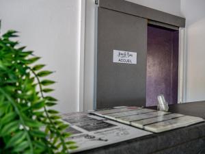a table with a mirror in a room with a plant at Maison Jean le Bon in Dax +47 photos