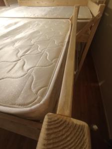 a mattress on a bunk bed in a room at Хостел Rest Sguear in Almaty