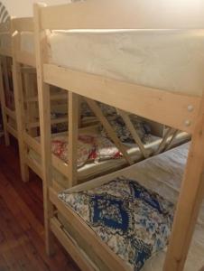 a group of bunk beds in a room at Хостел Rest Sguear in Almaty