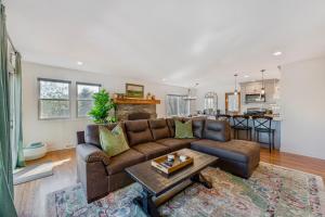 a living room with a couch and a table at Heritage Hollow in Cambridge