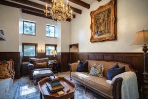 a living room with a couch and a table at Storybook Three Cottage Mountain Compound in Banner Elk