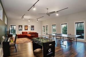 a living room with two tables and a couch at Heritage Hollow in Cambridge