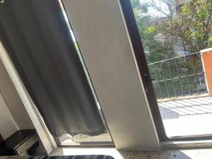 an open door of a room with a balcony at Hotel San Francisco in Villahermosa