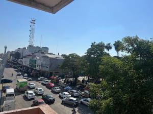a busy city street filled with lots of cars at Hotel San Francisco in Villahermosa