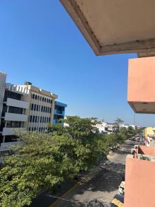 a view of a street with trees and buildings at Hotel San Francisco in Villahermosa