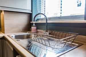 a dish drying rack in a sink in a kitchen at 61 Deneside in Lanchester +44 photos