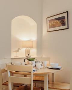 a dining room table with two chairs and a table with at The Wee Harbour Home in Anstruther +35 photos