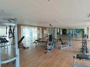 a gym with treadmills and machines in a room at KEY REALTY SERVICES Ph in Pajak