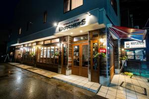 a store front of a building at night at MONTIS HOTEL Hida Takayama in Takayama