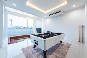 a billiard room with a pool table in the middle at The Pool Space - ICONIC Pool Villa in Ban Huai Yai +116 photos