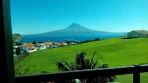 a view of the ocean from a house at Alice's House in Horta