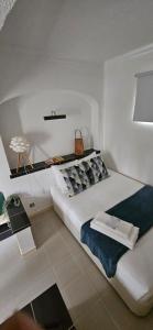 a bedroom with a large bed and a table at Herdade da Cova da Onça in Canha