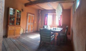 a dining room with a table and chairs and a window at tausend plus eine nacht in Vöhl